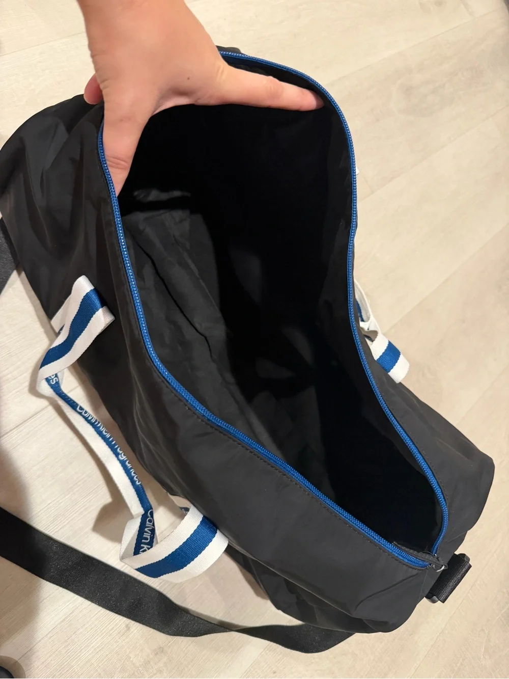 Calvin Klein Black Duffel with White-and-Blue Branded Handles